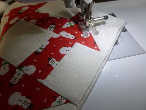 quilting with the open toe sewing machine foot on a christmas block