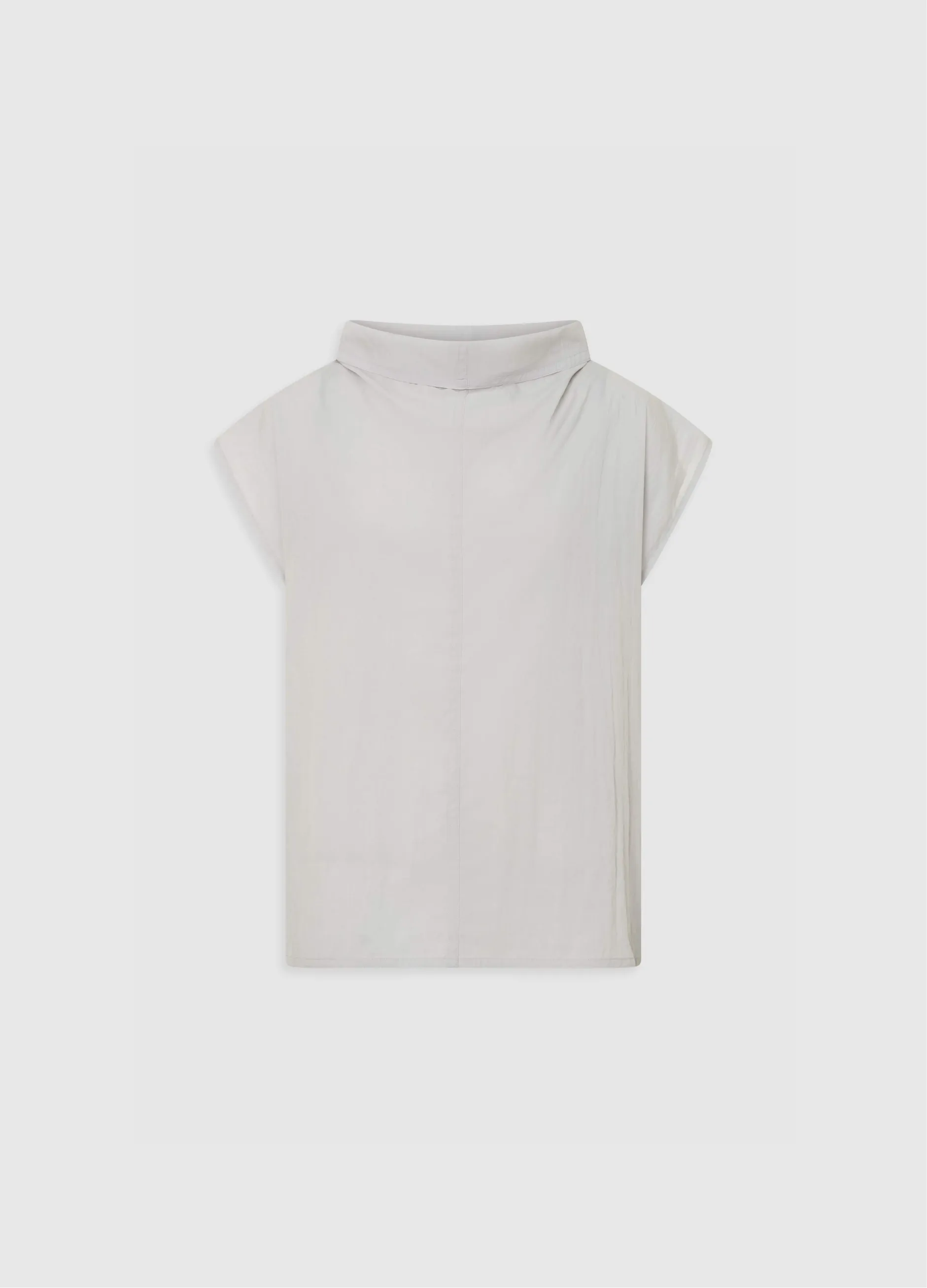 White sleeveless top with a high neckline and relaxed fit.