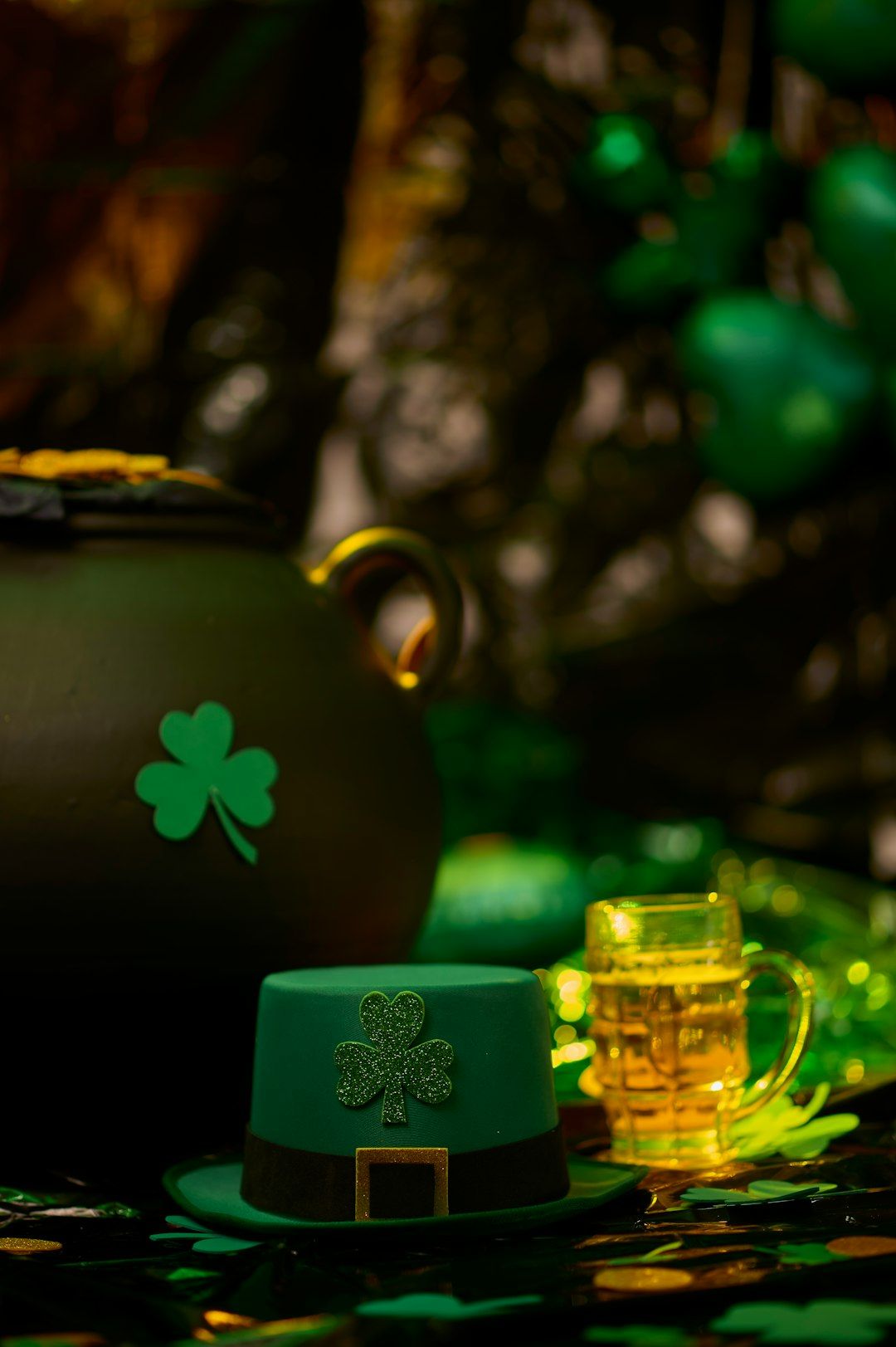 a pot of beer and a green hat on a table