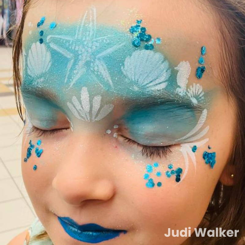 mermaid face paint design with stencils