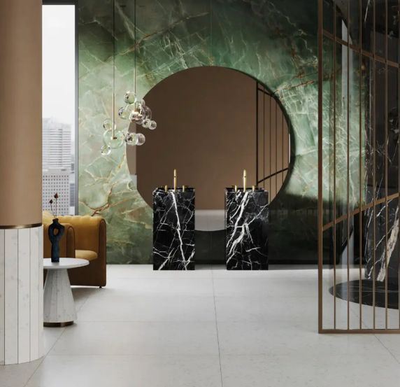 Modern interior featuring green marble wall and stylish furniture.