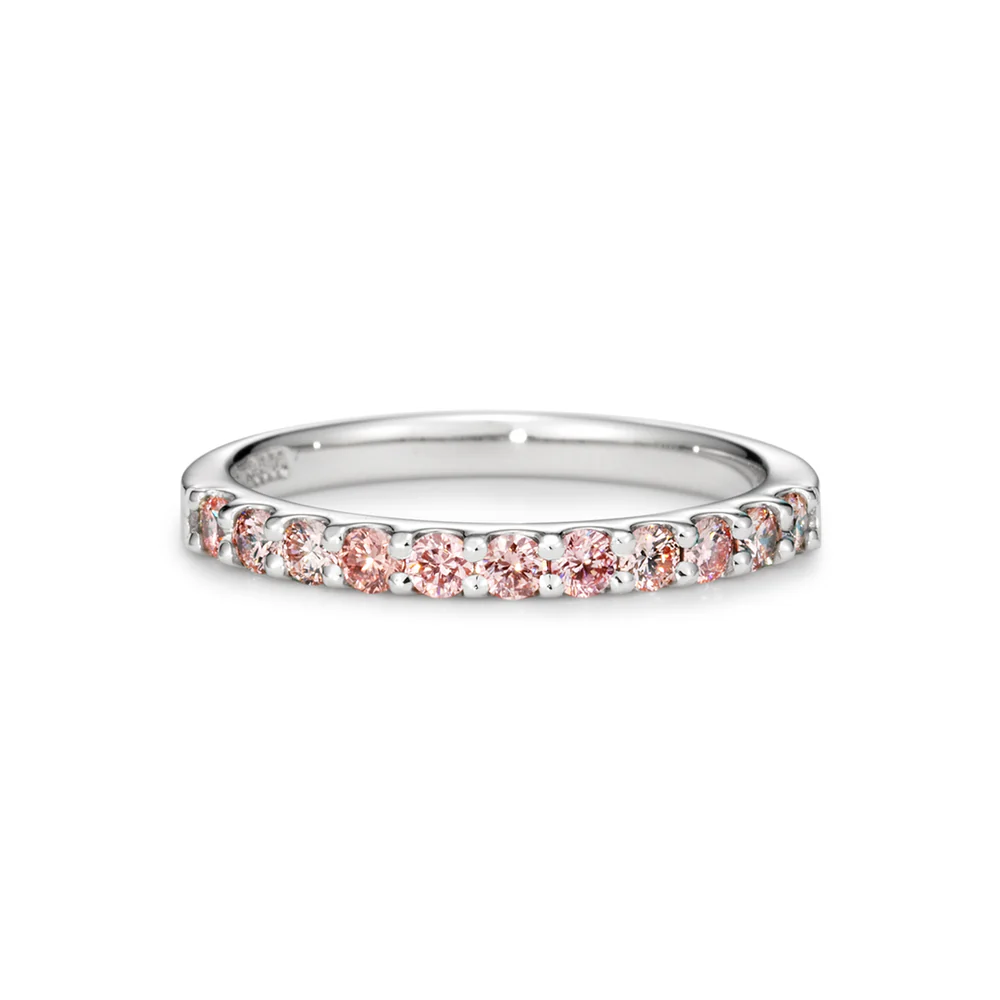 A silver ring adorned with pink gemstones.