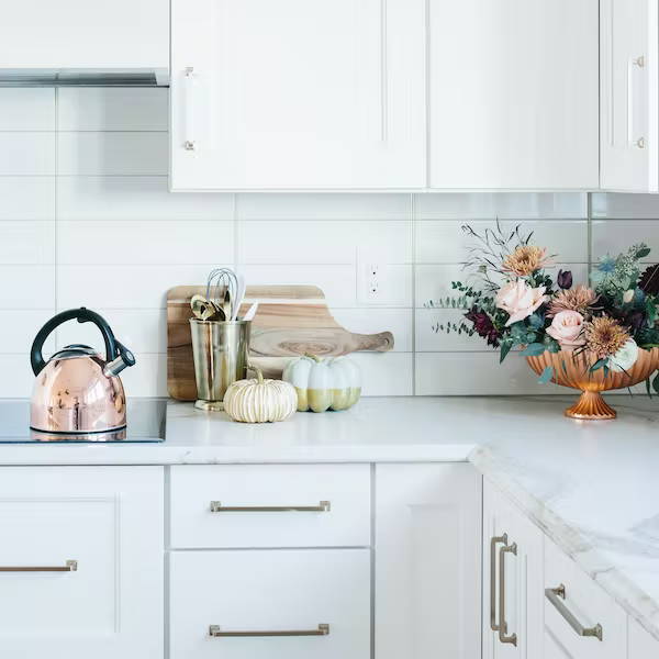 flowers and pumpkin decor in kitchen