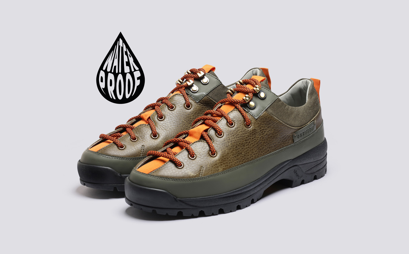 Grenson Sneaker 70 outdoor shoes with orange laces and a waterproof logo.