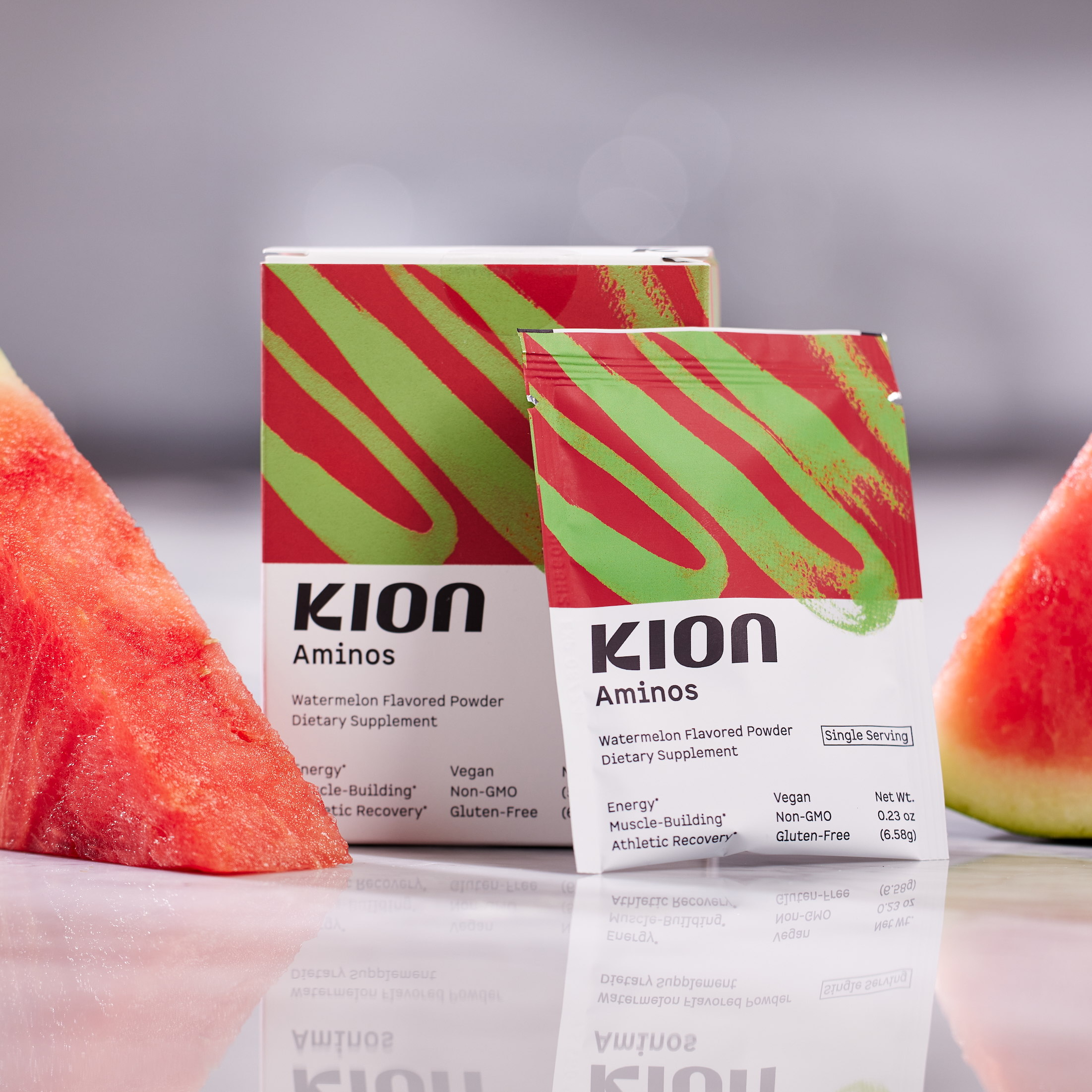 Boxes of Kion supplements next to slices of watermelon.
