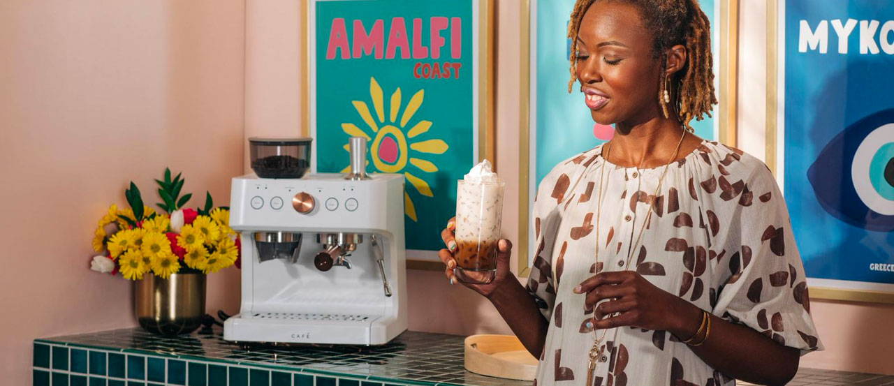 Woman holding iced white chocolate  mocha