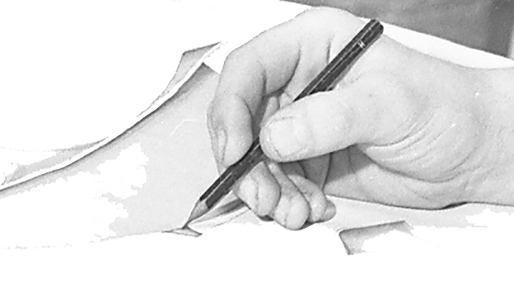 A hand holding a pencil, drawing on paper.