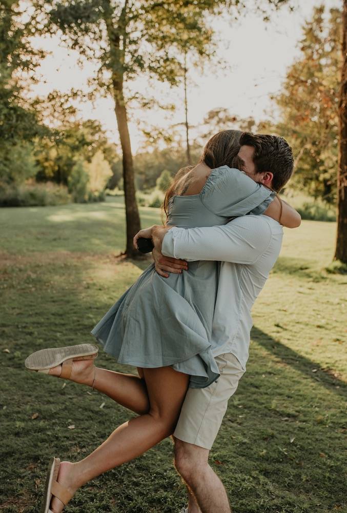 couple embracing after engagement