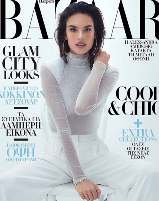 Model in stylish outfit on magazine cover with text.