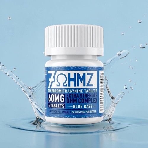Bottle of 7OHMZ tablets surrounded by splashing water on a blue background.