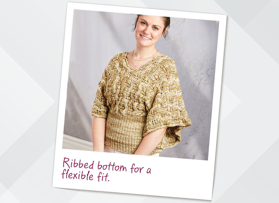 Woman wearing a crocheted top with a ribbed bottom for a flexible fit.