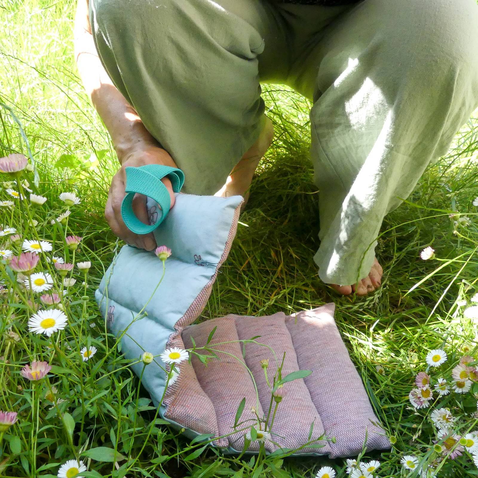 gardeing knee pad on the grass with little flowers