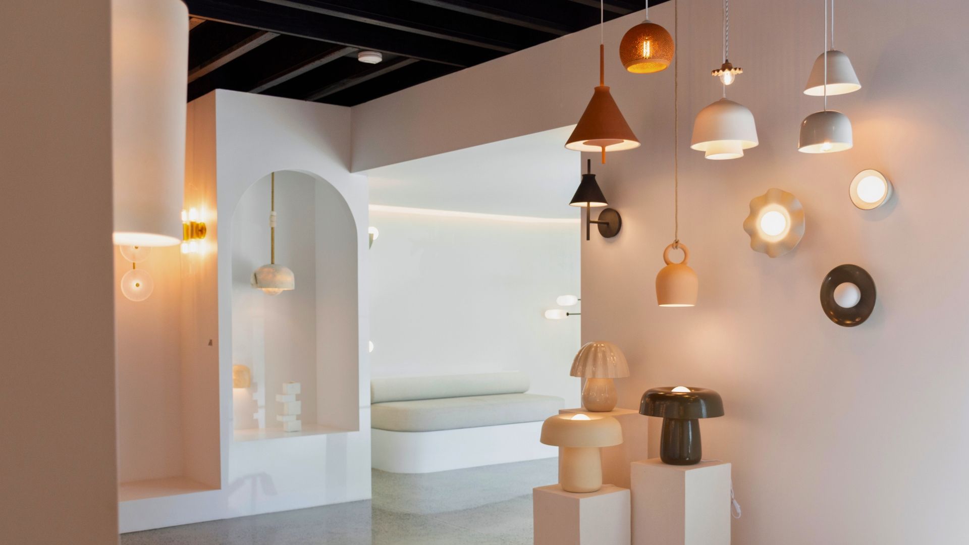 Showroom highlighting various stylish light fixtures on display.