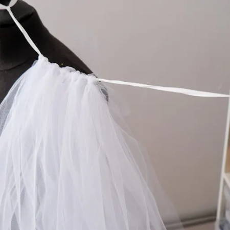 Tulle fabric strips attached to the waist band ribbon