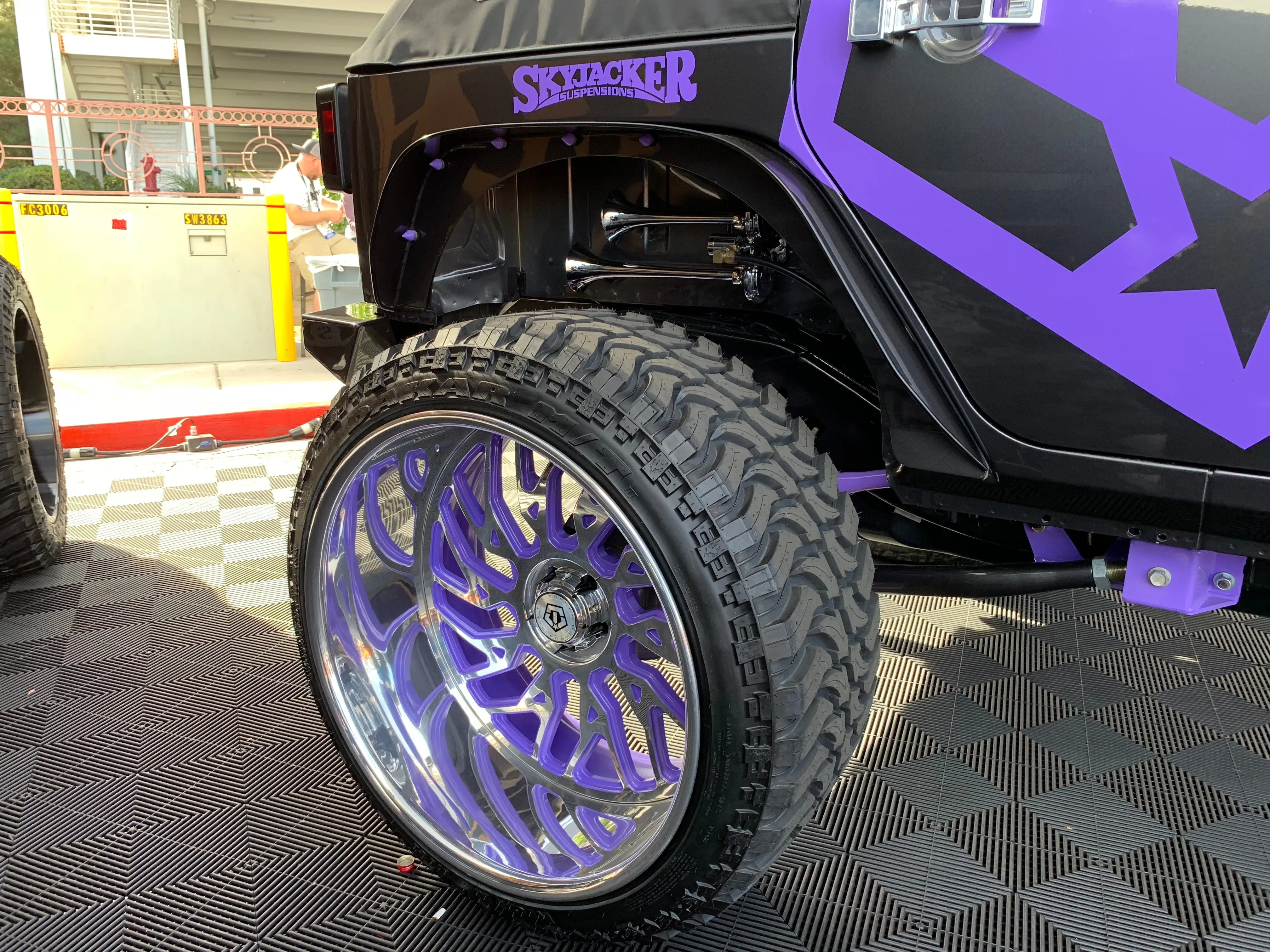 Side angle Janessa's 2017 Jeep Wrangler wheels tires exterior chrome accents PsychoBlasters chrome air horn front clip gallery photo 2