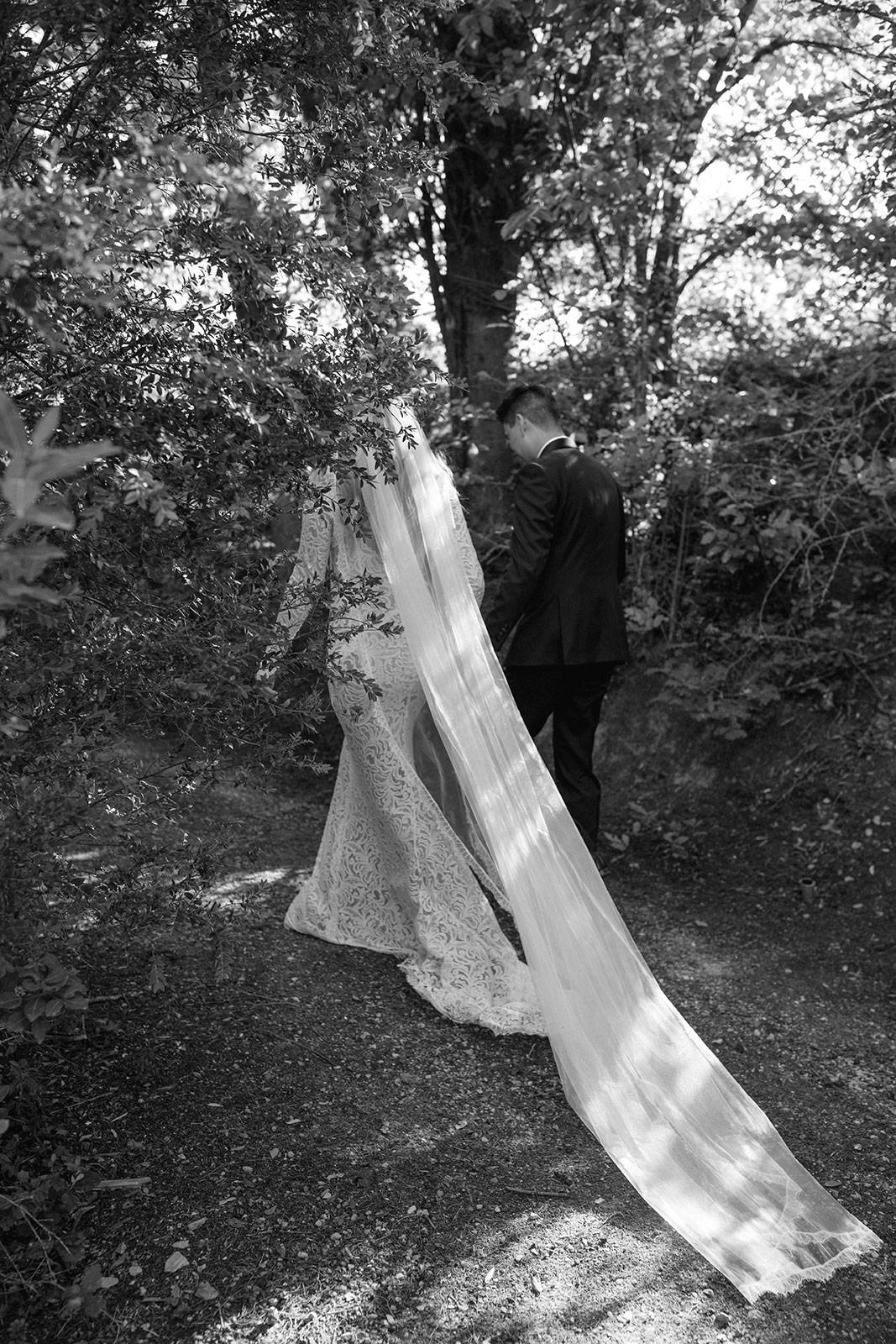 Black and White image of GRACE Bride Taylor with Olive Gown and Lumi Veil