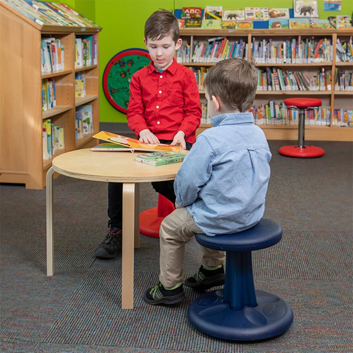 Boys sitting on Kore Design wobble chairs