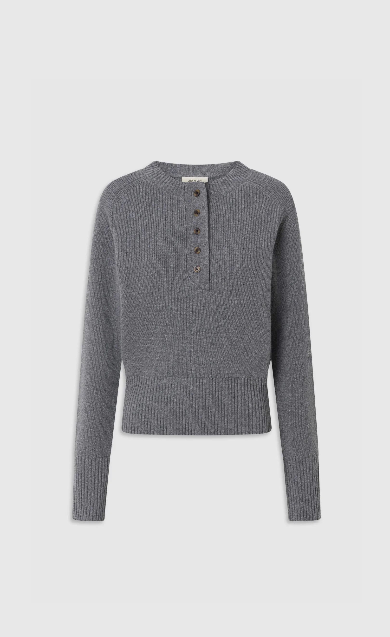 Gray long-sleeve sweater with a buttoned neckline.