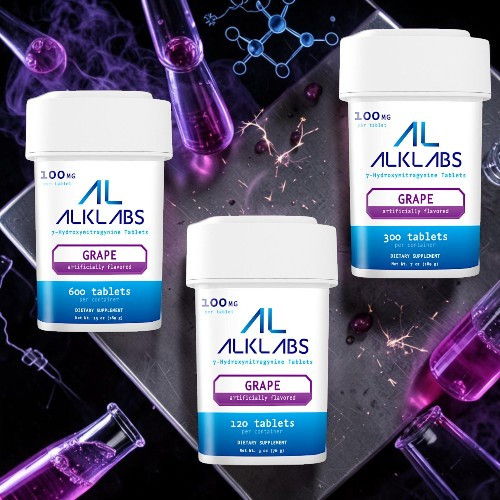 Three containers of ALKLABS grape tablets against a colorful lab background.