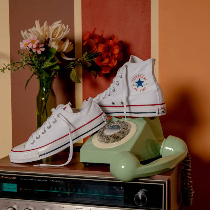 white converse in vintage room setting