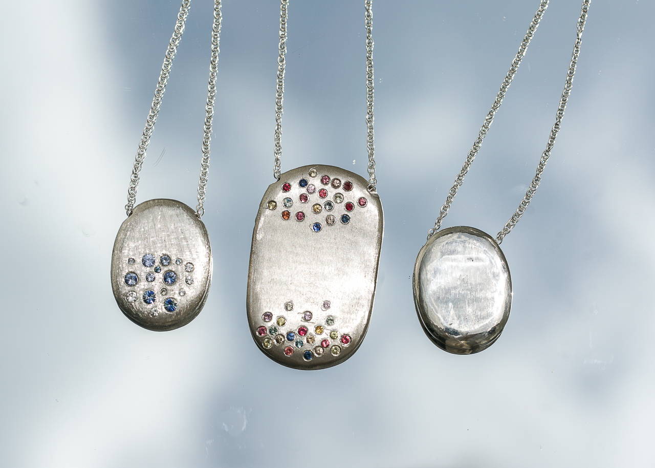 starburst silver necklaces with sapphires