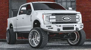 Holden's lifted white 2017 Ford F250 Super Duty with custom front bumper and chrome wheels