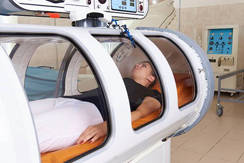 girl patient lying hyperbaric chamber