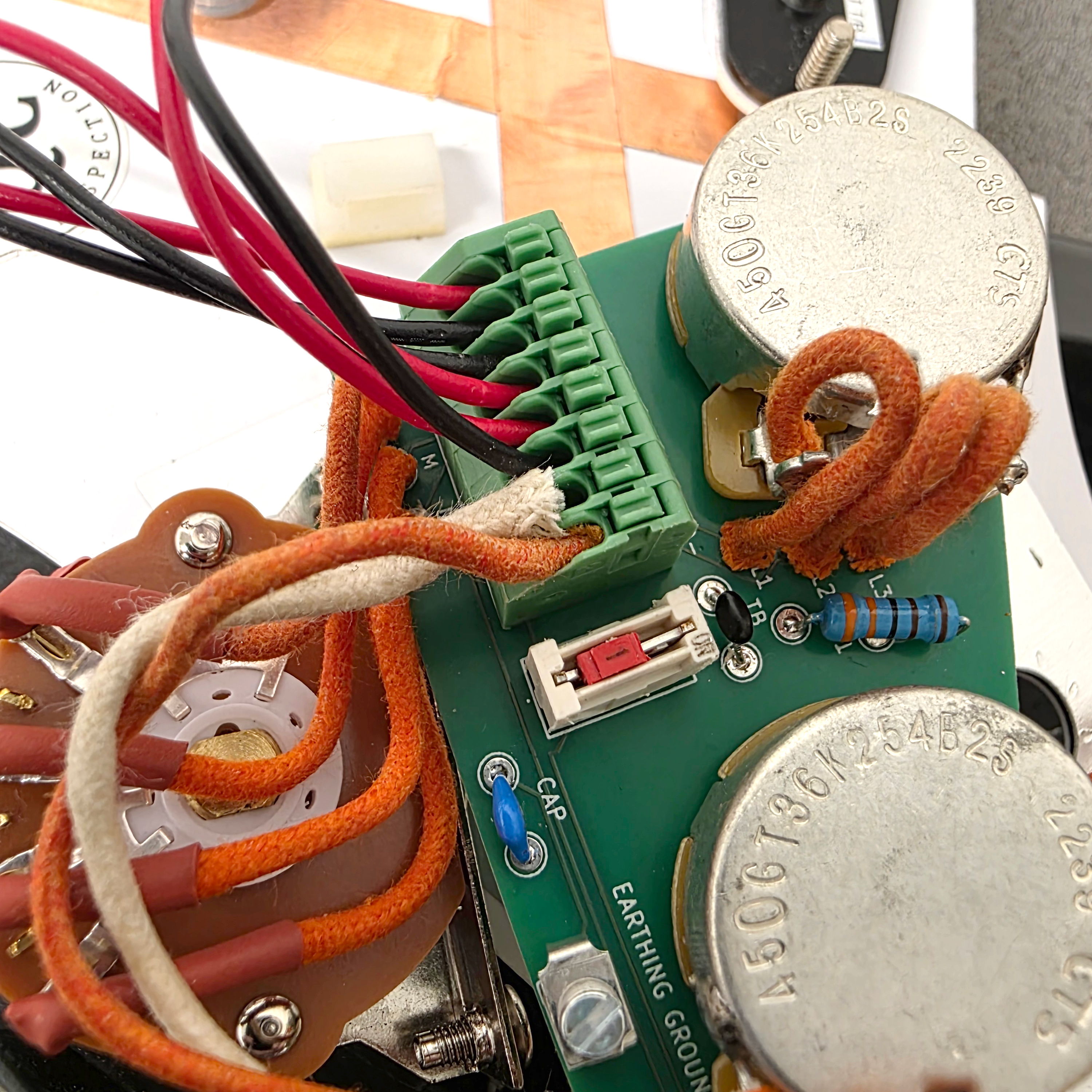 Close-up of a circuit board with wires and components.