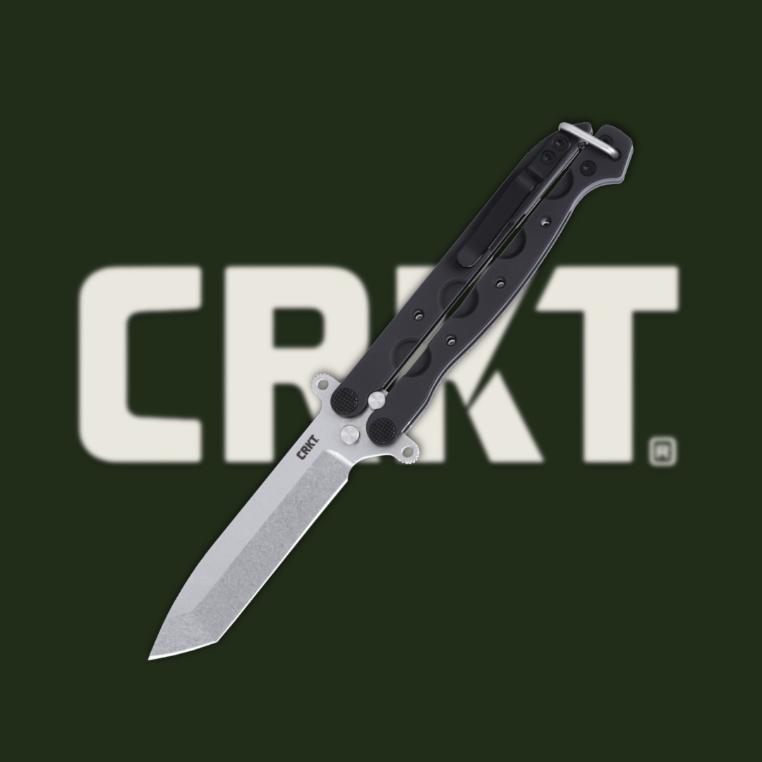 CRKT knife with a black handle against a dark background.