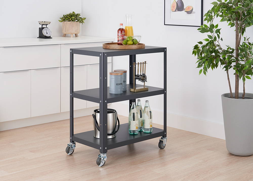 Metail utility cart in the kitchen with items on shelves
