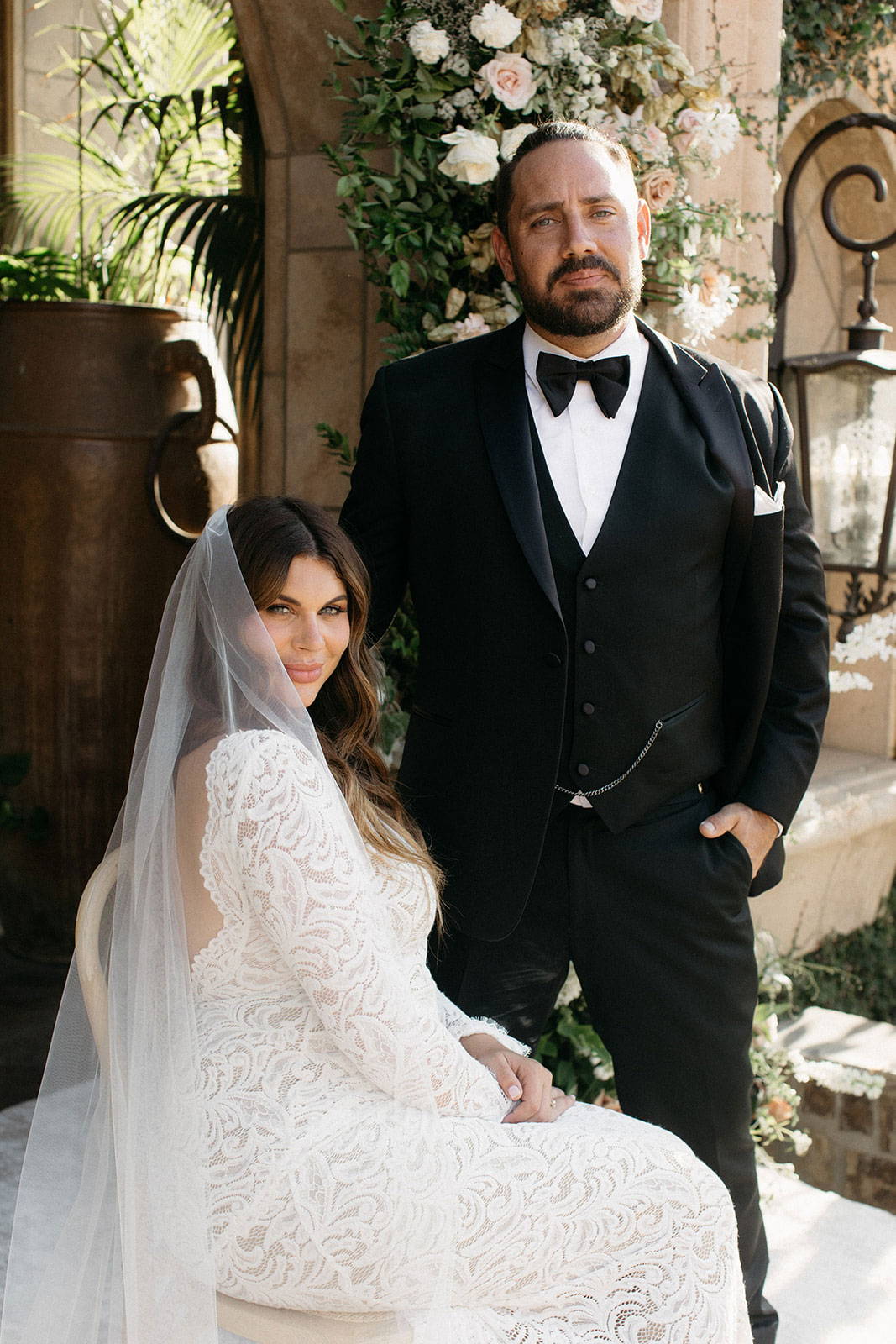 Bride sitting down next to Groom