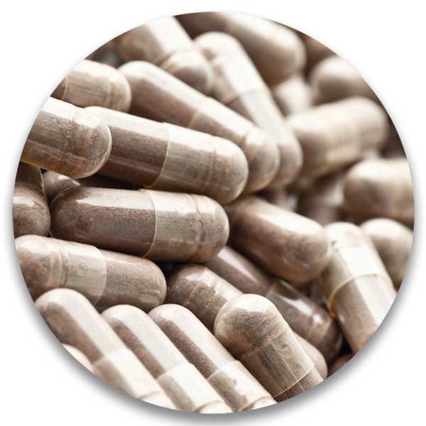 Close-up of beige capsules stacked together.