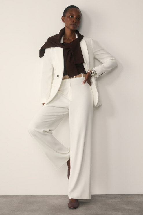 Model wearing Ivory Clever Crepe suiting