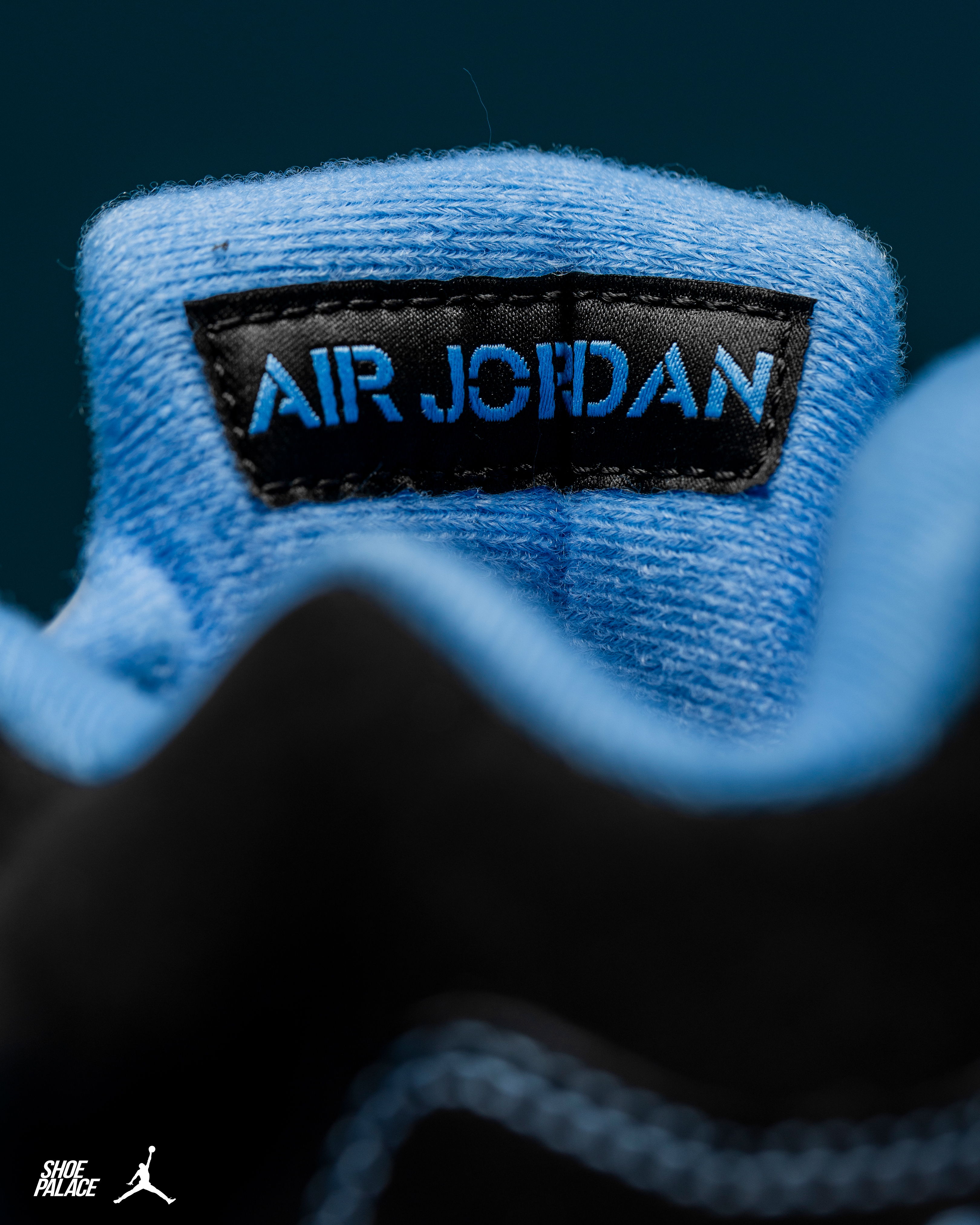 Close-up of an Air Jordan shoe tag with blue and black colors.