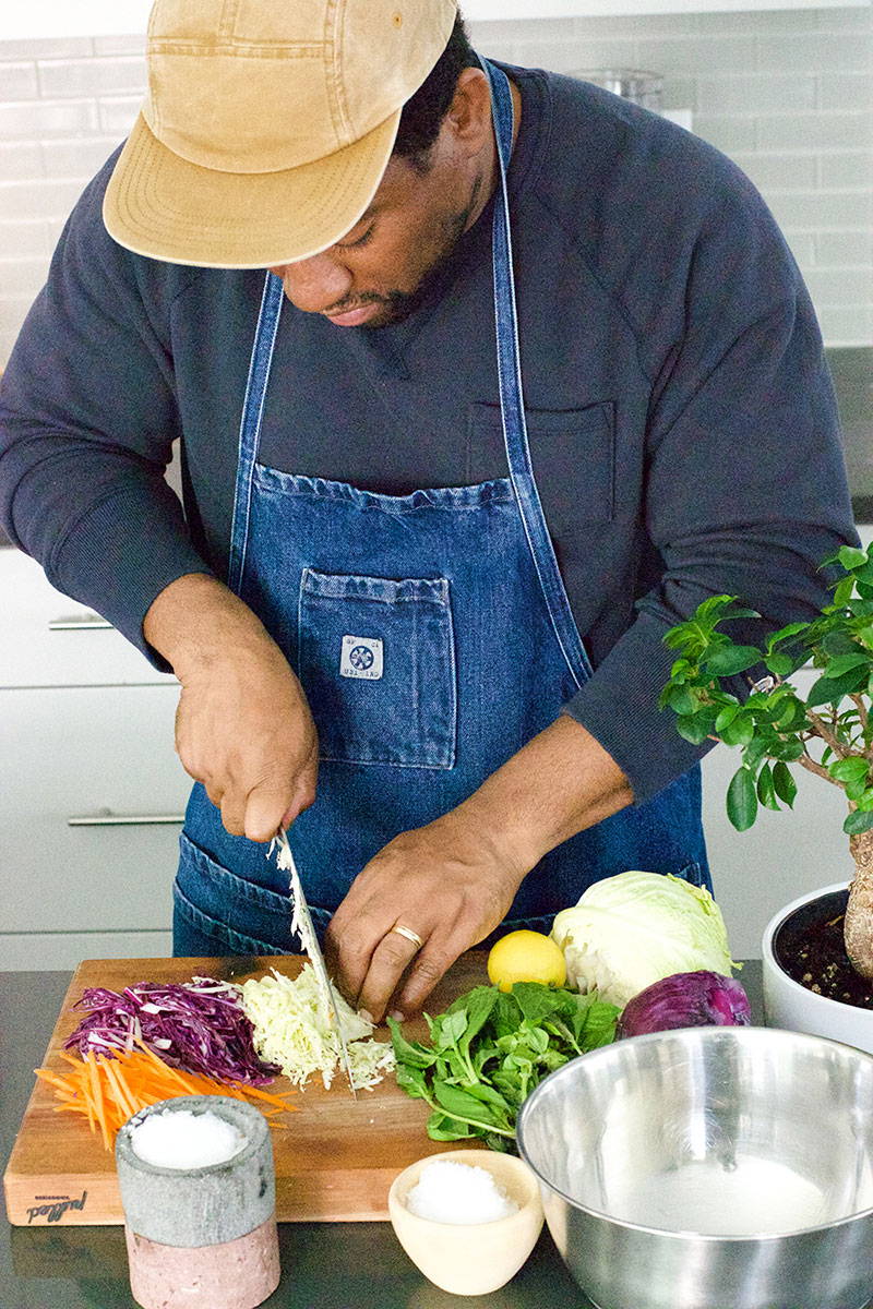 Rashad from Yoshi Jenkins cutting through cabbage