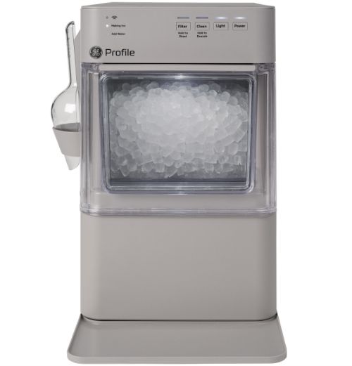 Ice maker appliance with a transparent front and control panel on top.