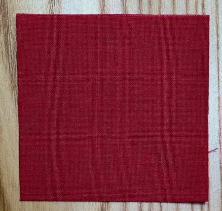 Closeup of dark red 2.5 inch square of fabric