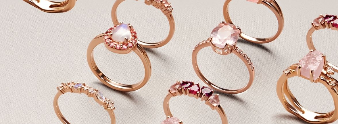 A collection of elegant rose gold rings with various designs and gemstones.
