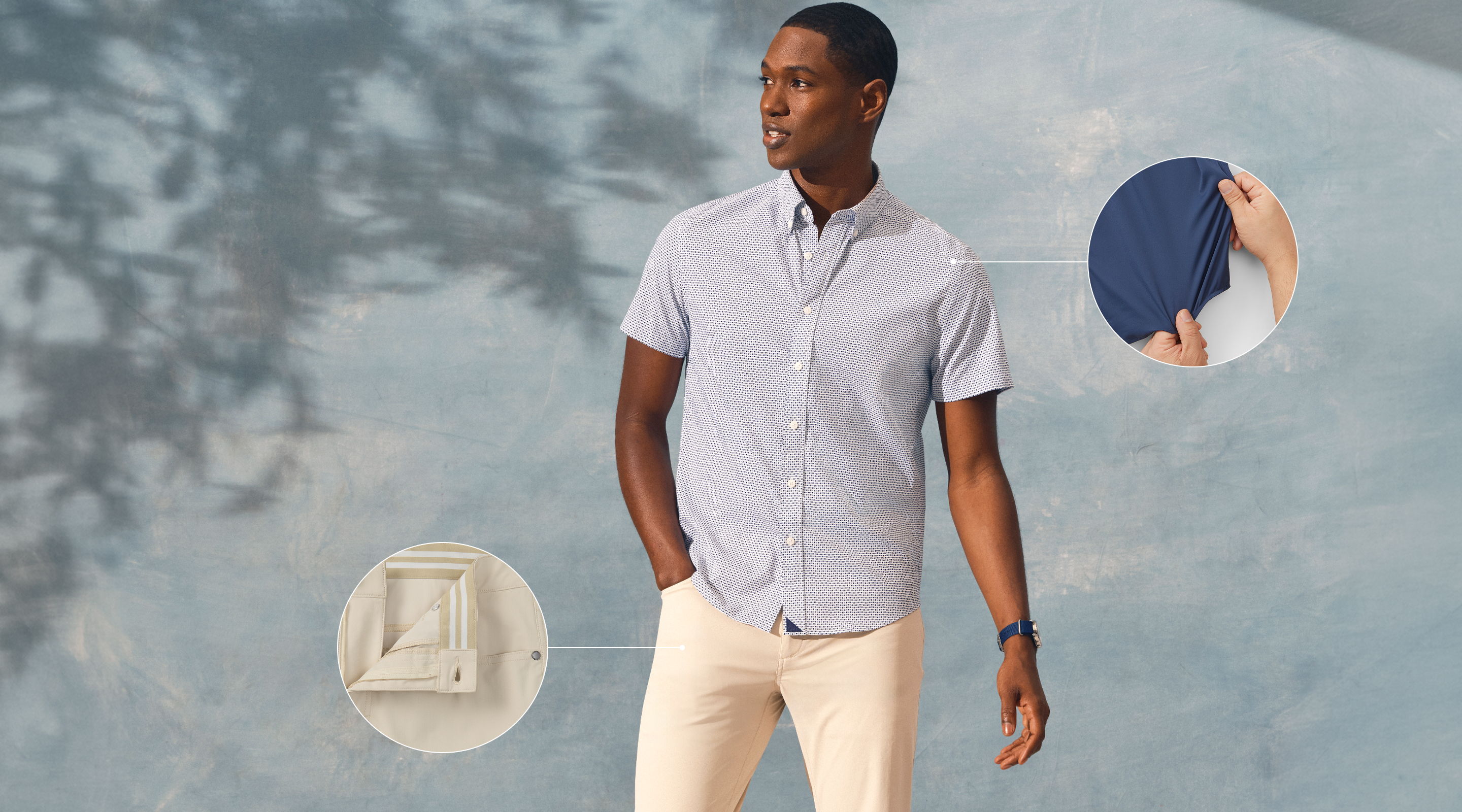 Man wearing a light shirt and pants, with fabric swatches nearby.