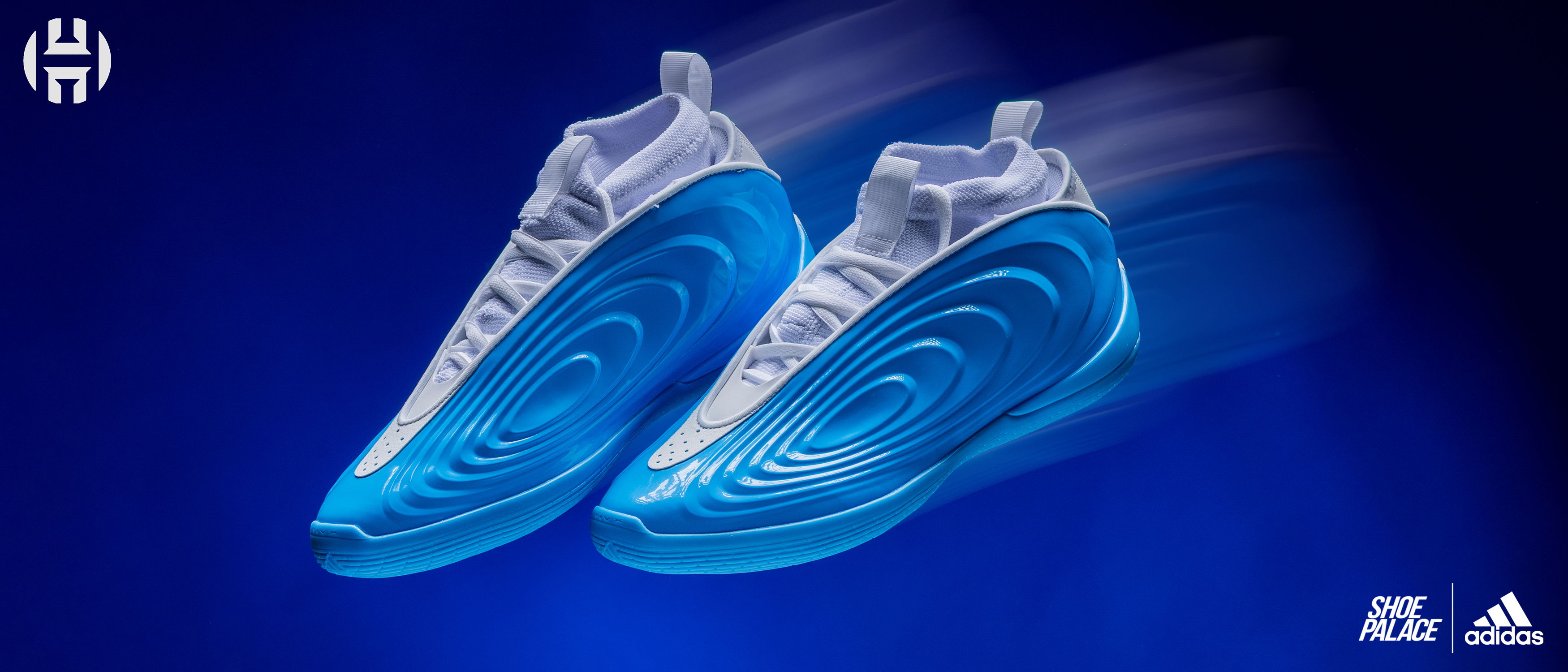Blue athletic shoes on a blue background with motion blur effect.