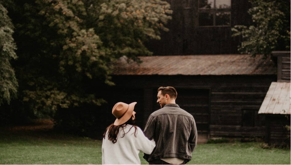 couple outside barn