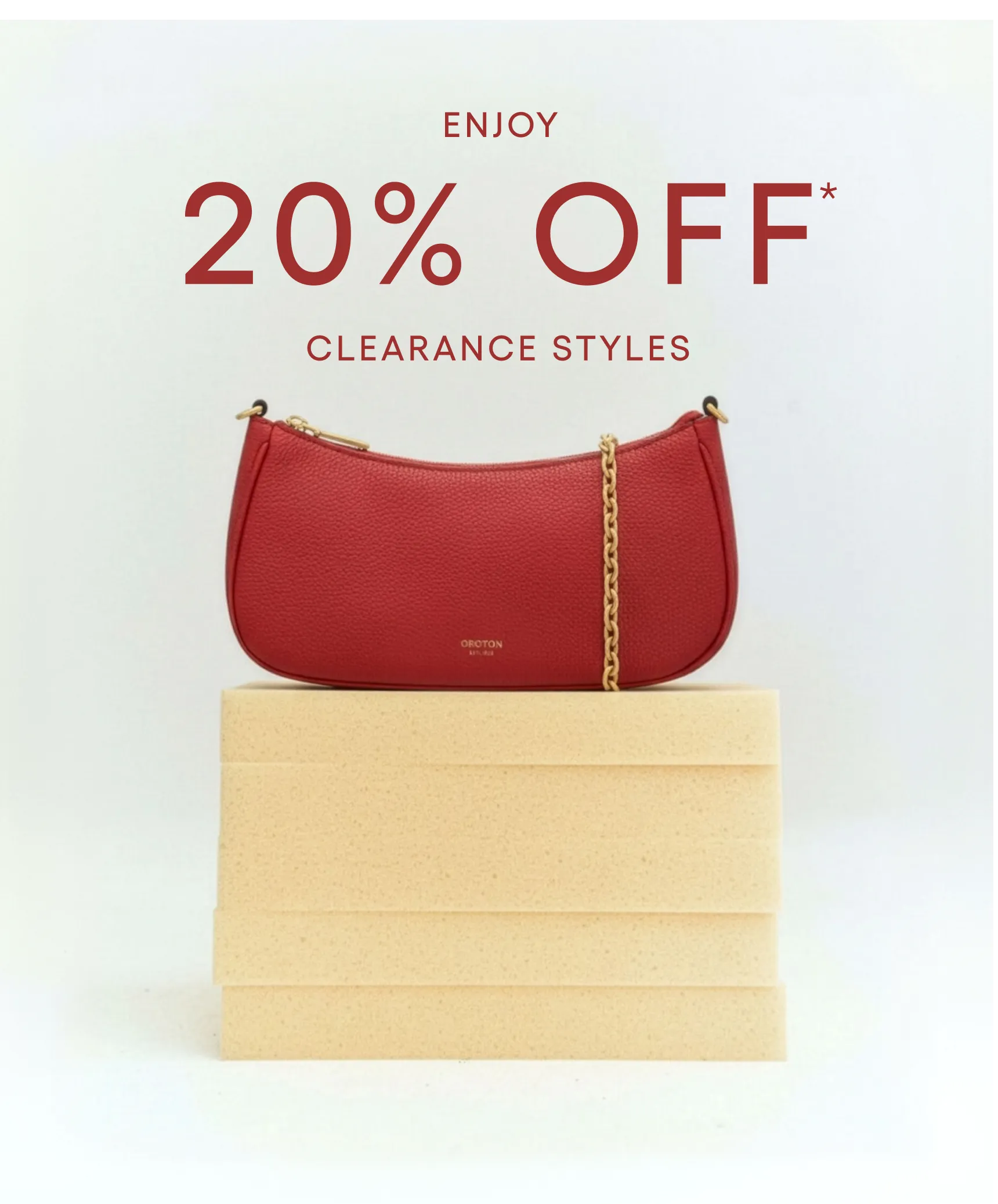 Red handbag on stacked boxes with 