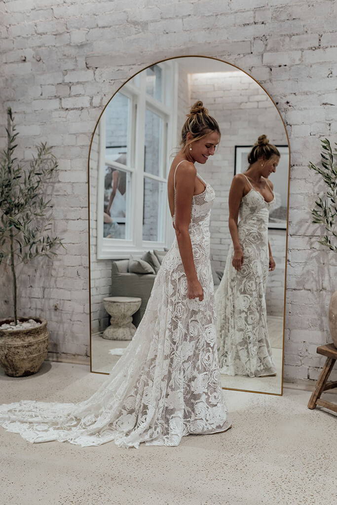 Women wearing the Grace Loves Lace rosa gown in chic arch mirror