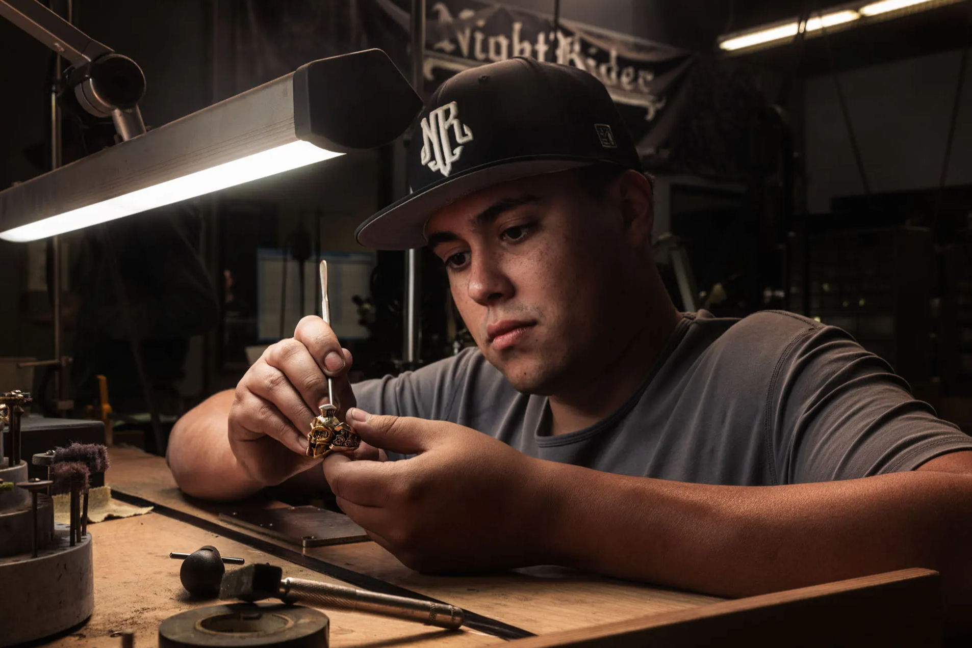 A jeweler handcrafts a NightRider Luxe ring