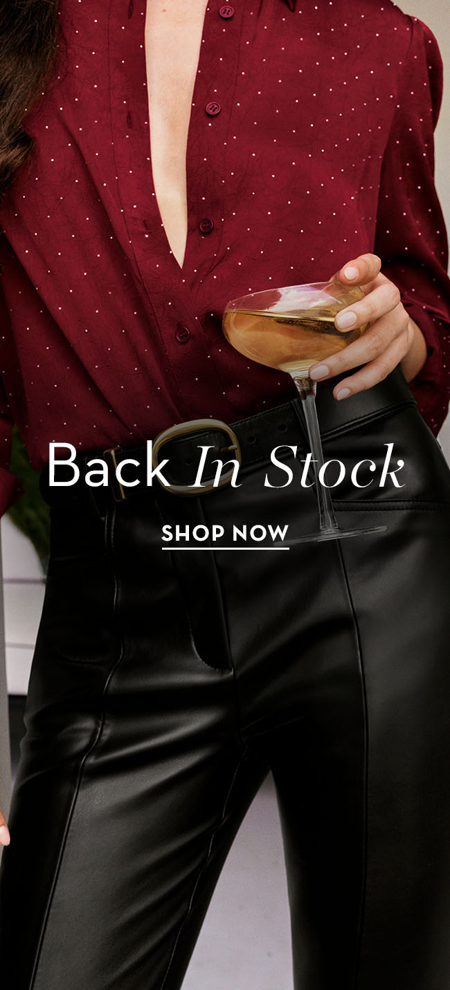 Woman holding a drink in stylish outfit with promotional text.