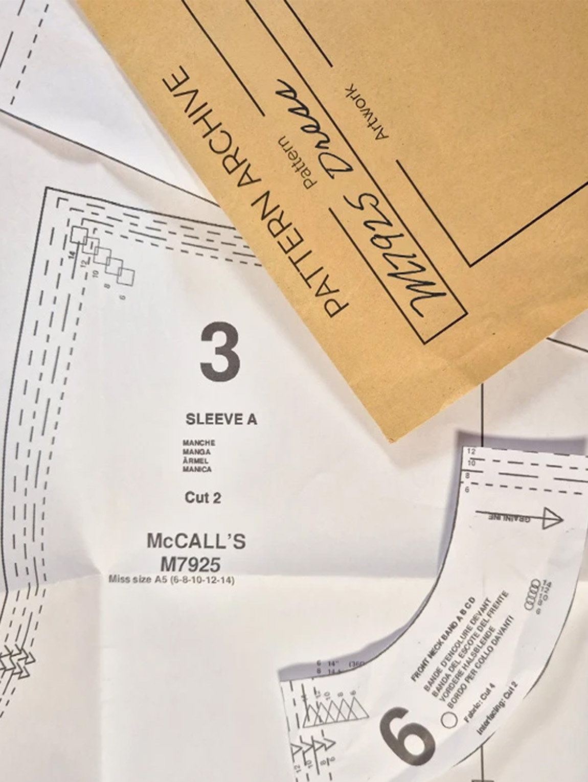 Sewing pattern pieces and envelope labeled 