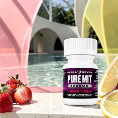 Bottle of Pure Mit supplements with strawberries and lemon near a pool.