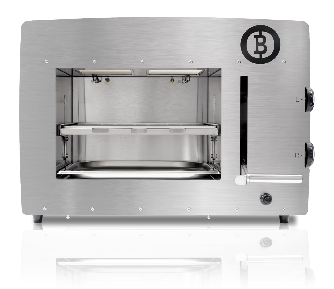 Stainless steel toaster oven with a logo and visible interior racks.