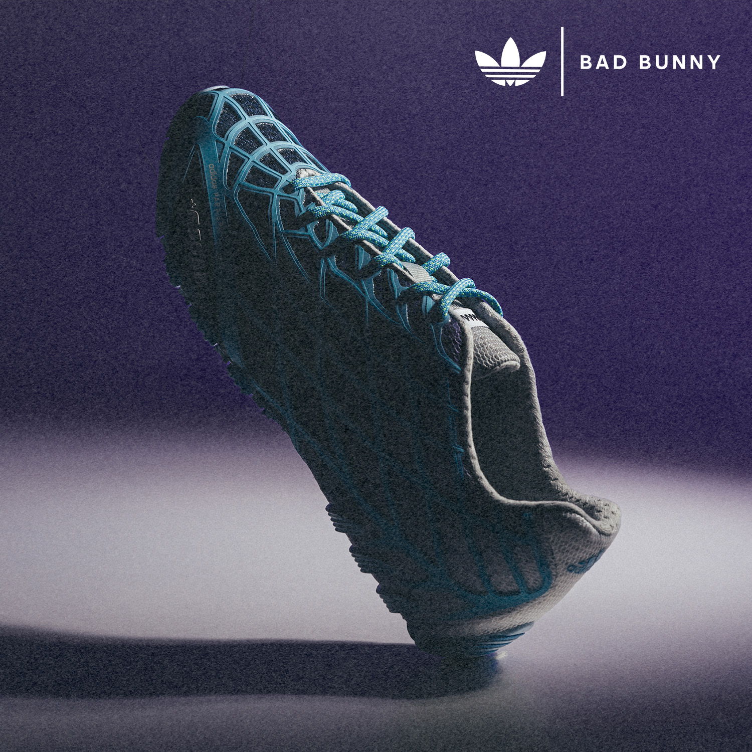 Adidas shoe featuring Bad Bunny design against a purple background.