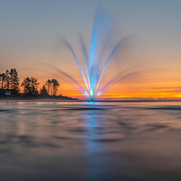 Colored LED Pond Fountain Lights at sunset